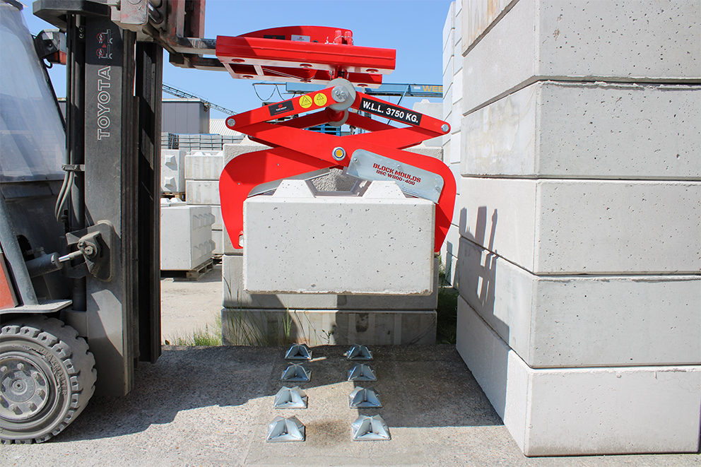 concrete block being placed on ground nocks